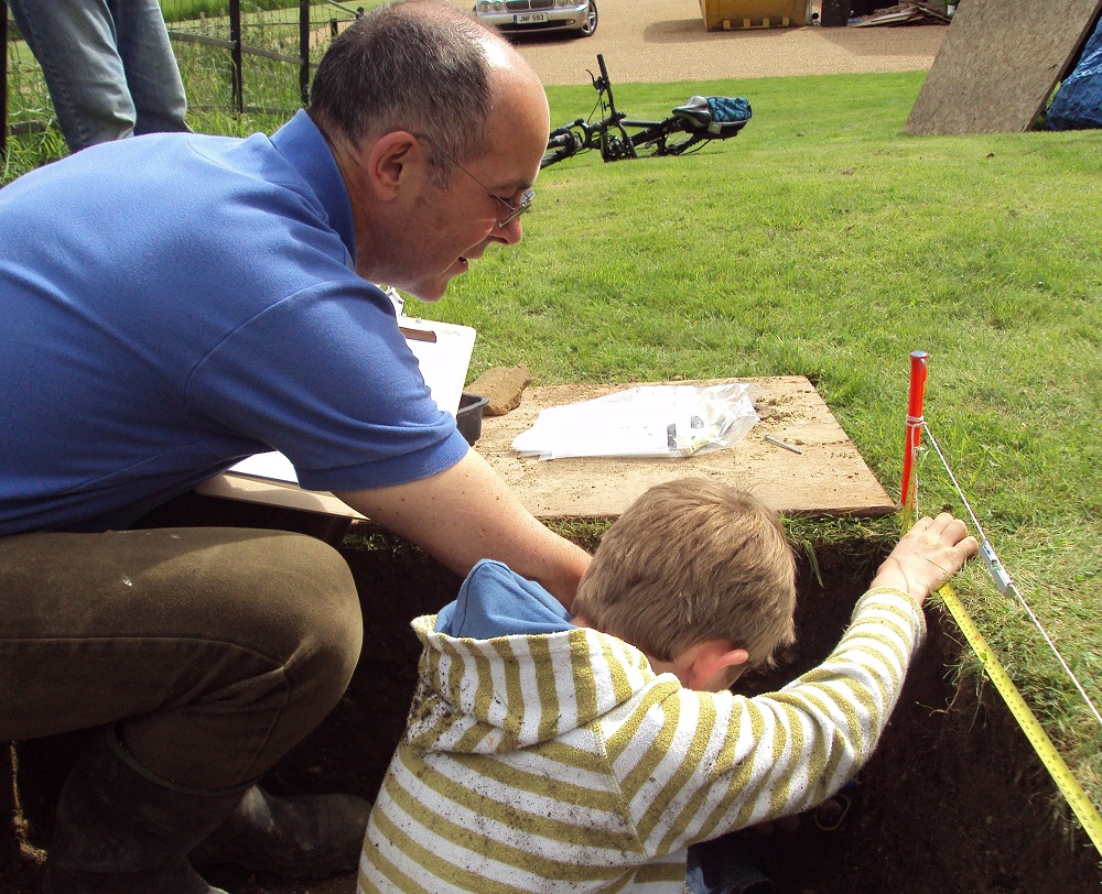 2. Cascading skills - a Jigsaw volunteer shows a young persion how to Draw a section - Copy